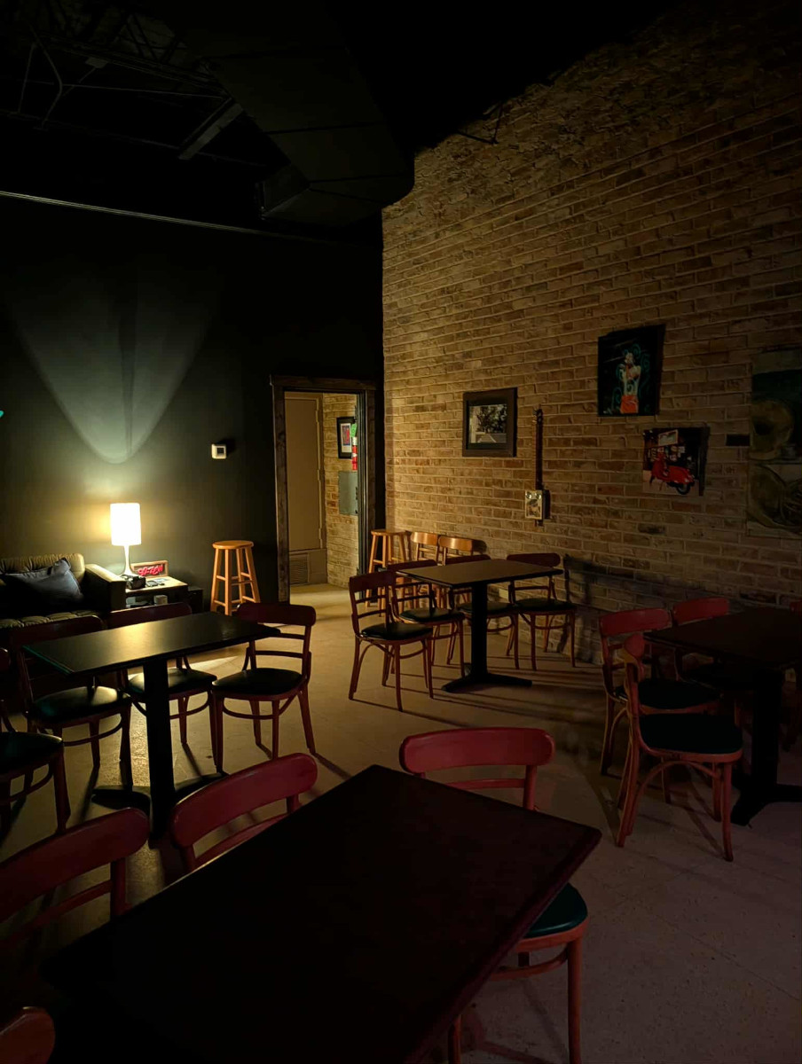 The People's Room interior — exposed brick and warm lighting